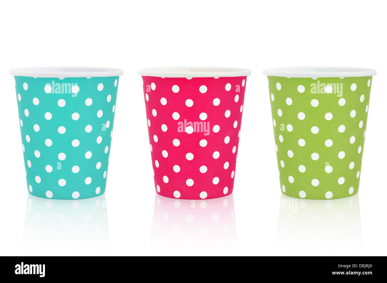 Colorful polka dot paper cups isolated on white. Stock Photo