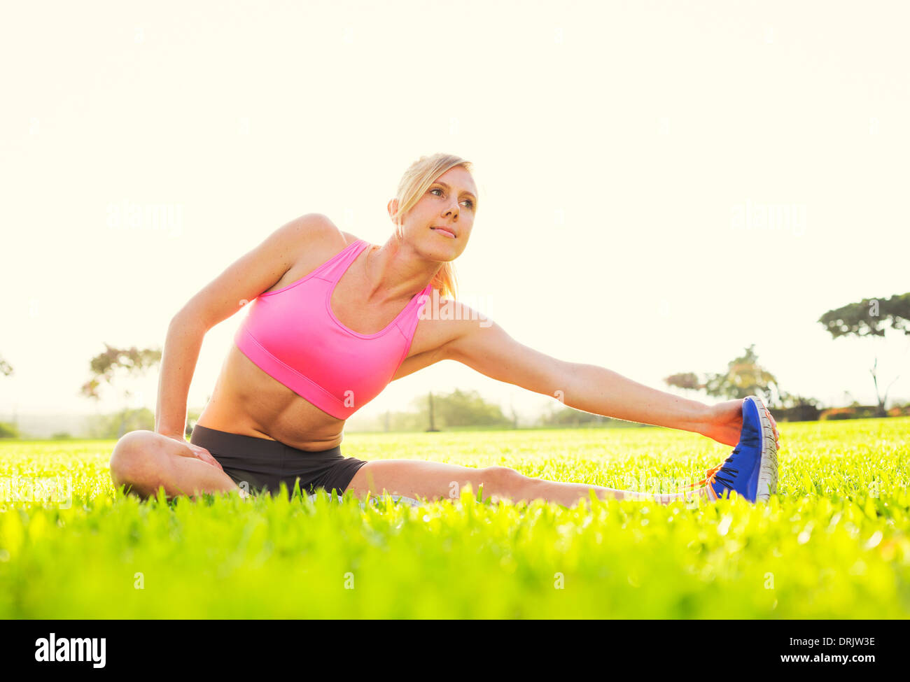 Close Up Side View of Woman Legs Stretching the Muscles of the Foot in Gray  Sports Thermal Underwear with Pattern. Stock Photo - Image of hips, season:  67102912