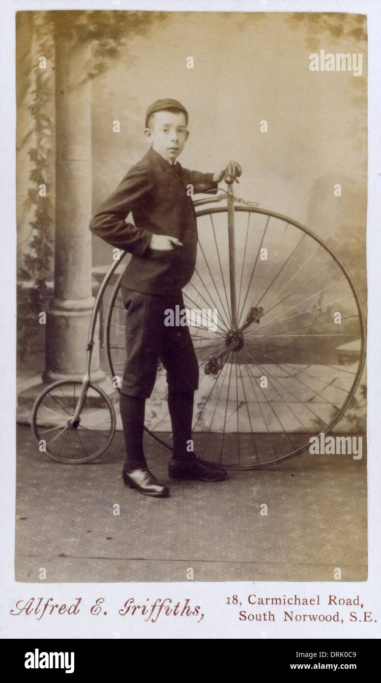 Young Boy with a Penny Farthing Bicycle Stock Photo