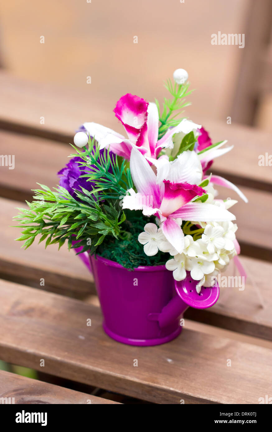 Artificial flowers in colorful metallic vase Stock Photo Alamy