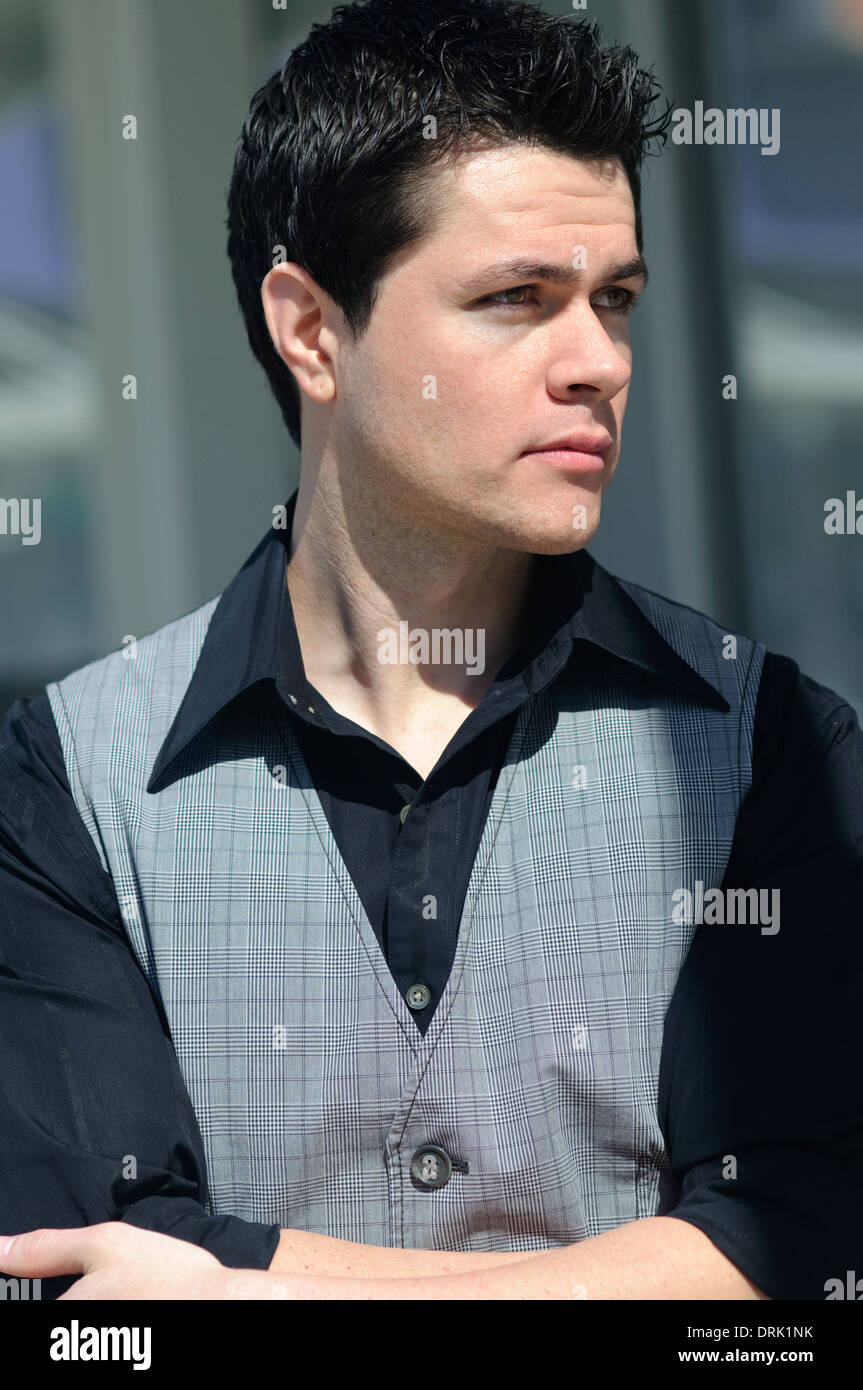 White Caucasian man, handsome young man with black hair looking away Stock  Photo - Alamy