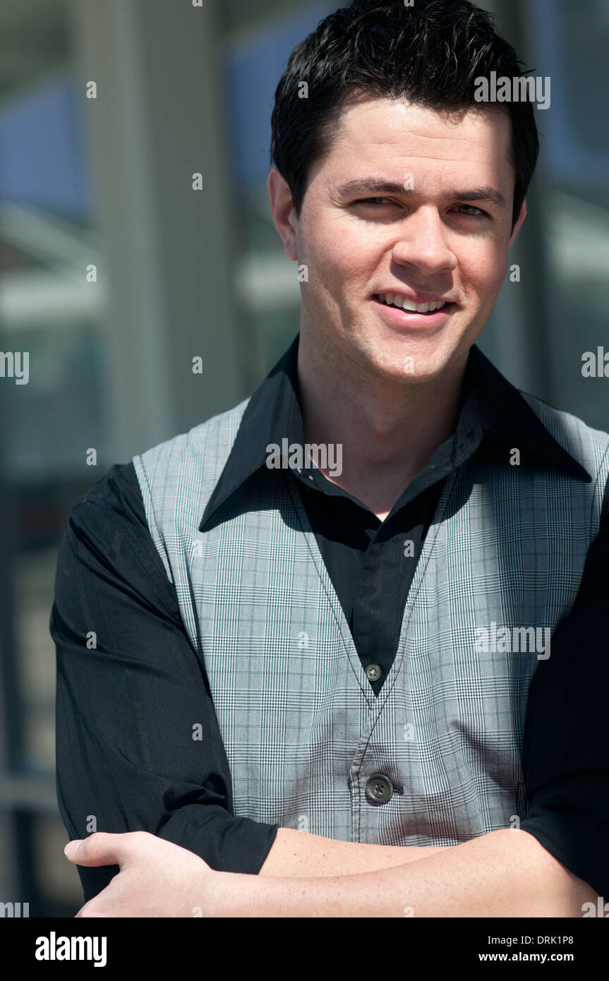 handsome young man portrait smiling waist up Stock Photo