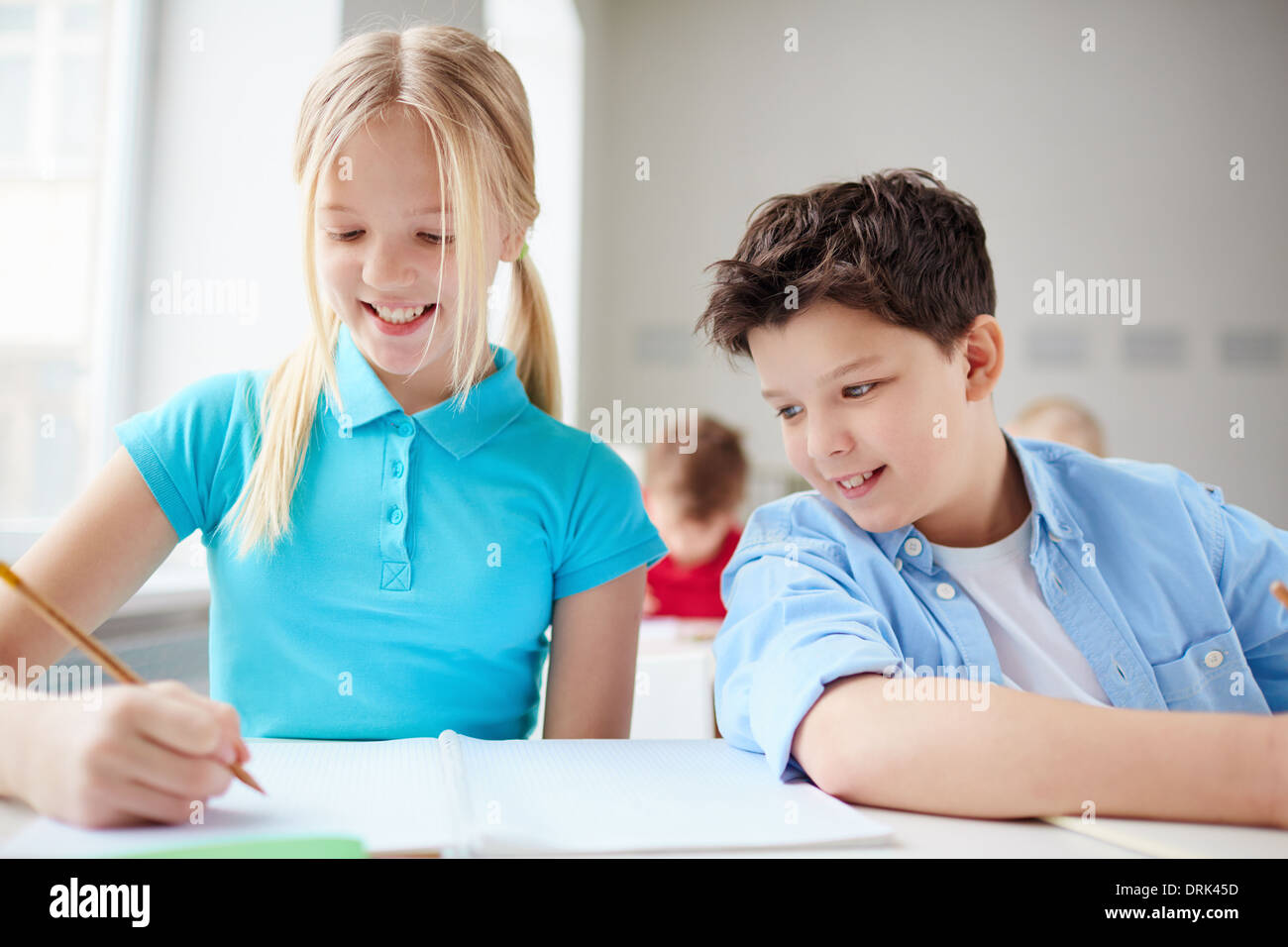Portrait of two diligent pupils drawing at lesson Stock Photo - Alamy
