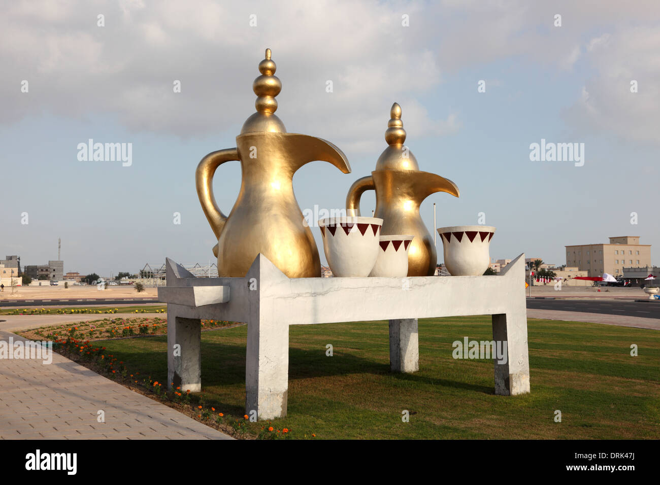 Golden Arabian Coffee Pot. A Roundabout in Al Khor, Qatar, Middle Stock