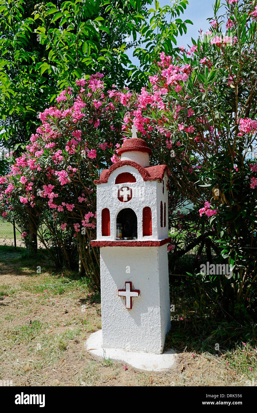 Memorial place and blooming Oleander (Nerium oleander), Central Makedonia, Greece Stock Photo