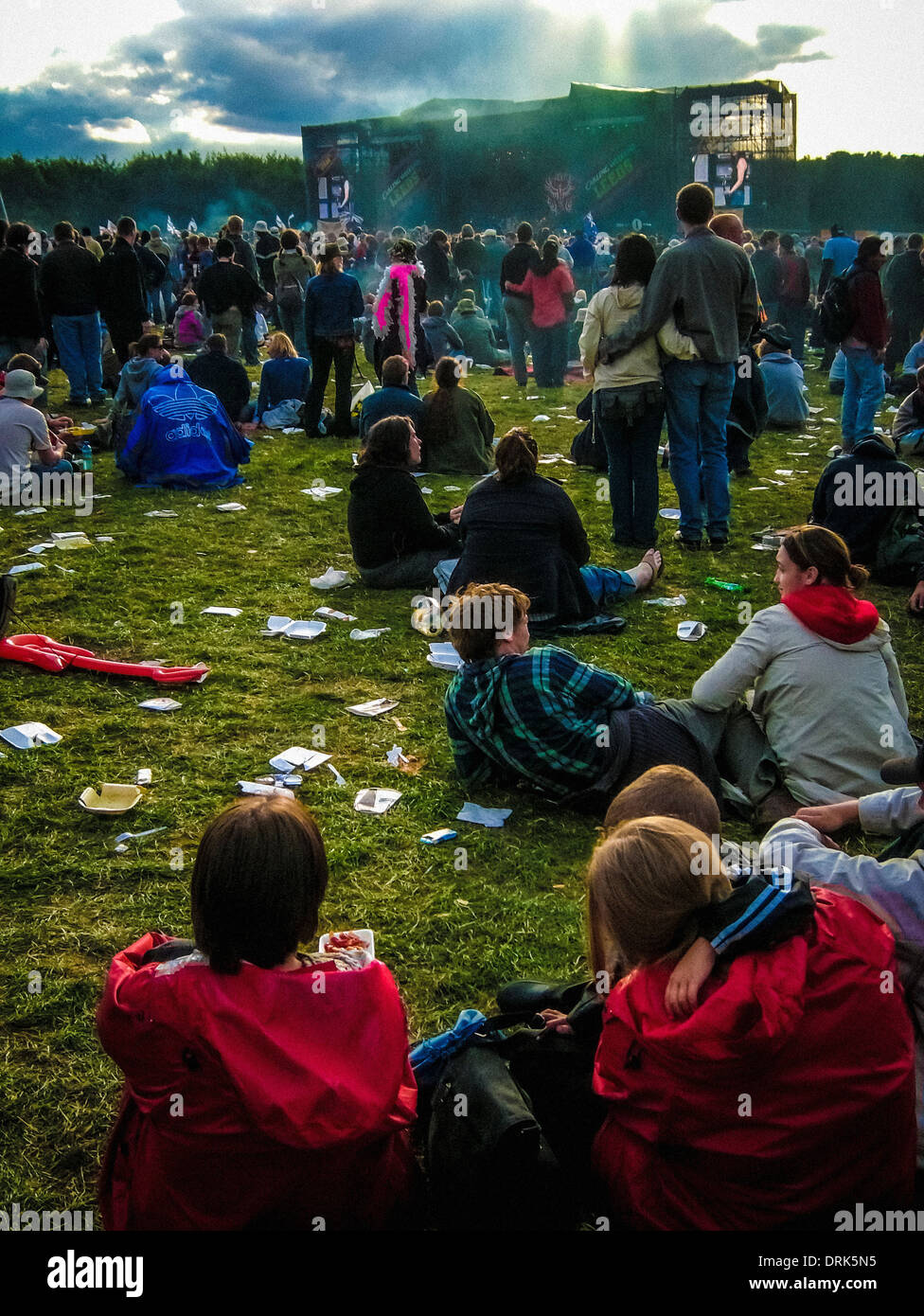 Fans at music festival watching stage Stock Photo