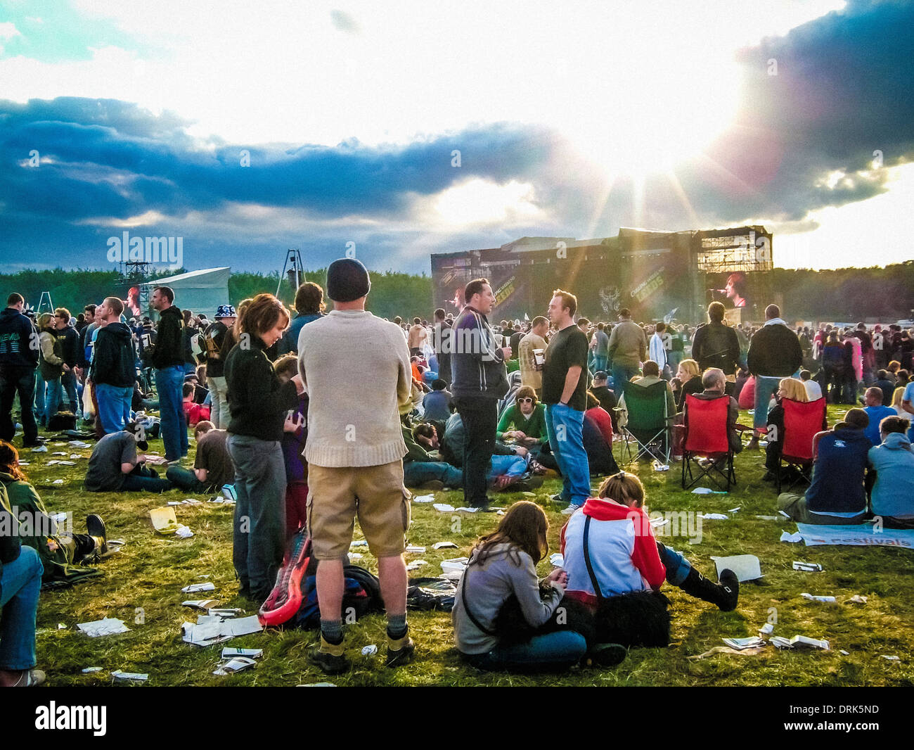 Fans at music festival watching stage Stock Photo