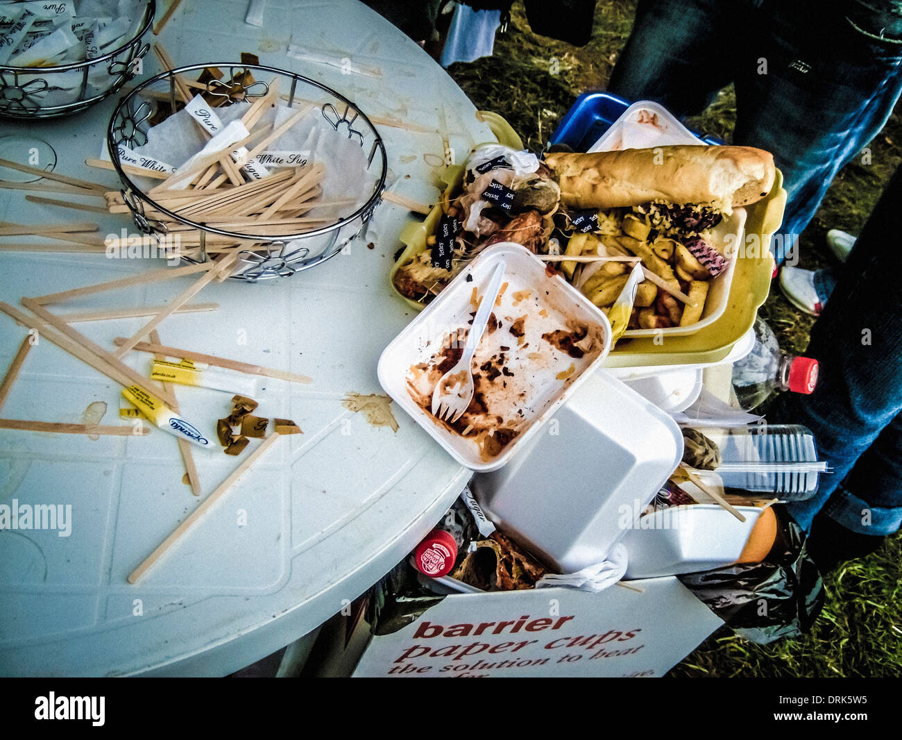 Discarded fast food leftovers at an outdoor event. Stock Photo