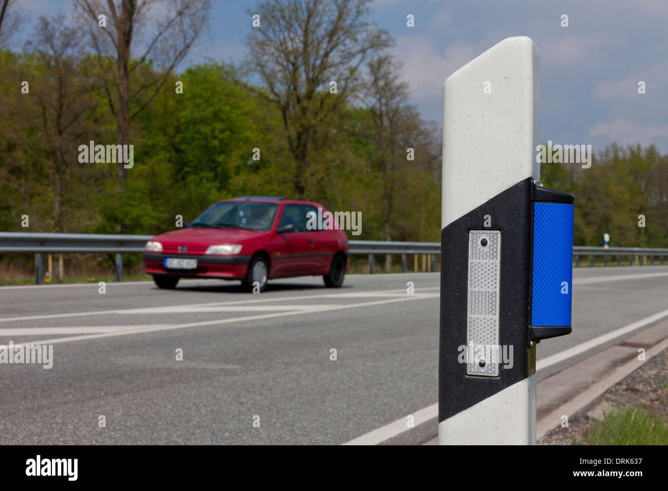 Wildlife warning reflector at the roadside. Germany Stock Photo