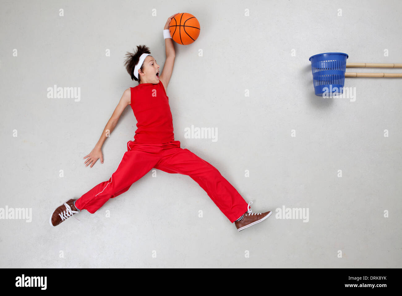 Boy playing basket ball Stock Photo