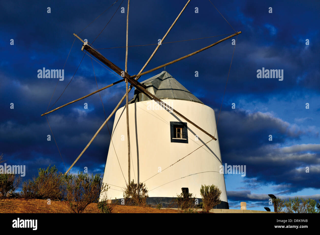 Portugal, Algarve: Historic and restored windmill on the hill of Revelim de Santo Antonio in Castro Marim Stock Photo