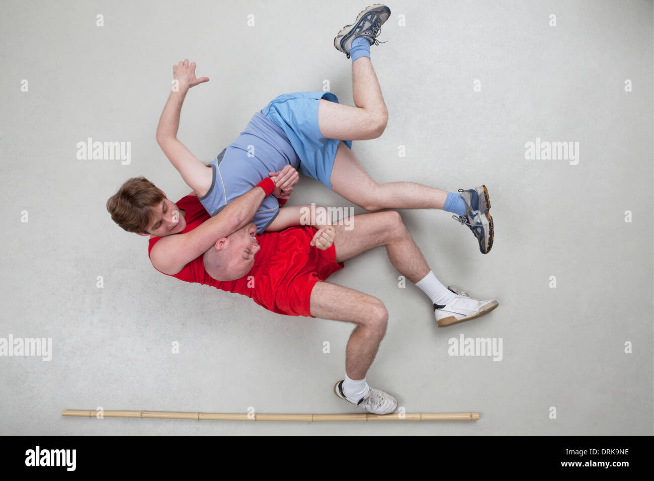 Two men wrestling Stock Photo
