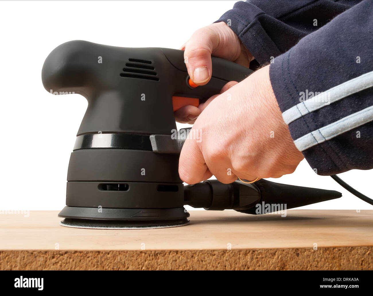 worker with sander machine working on wooden surface Stock Photo