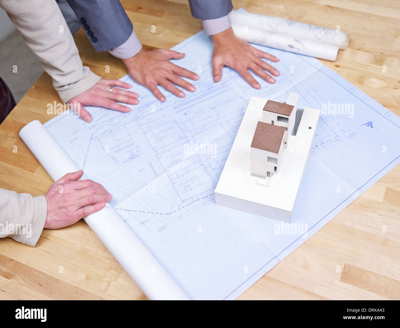 business people reviewing blueprint Stock Photo