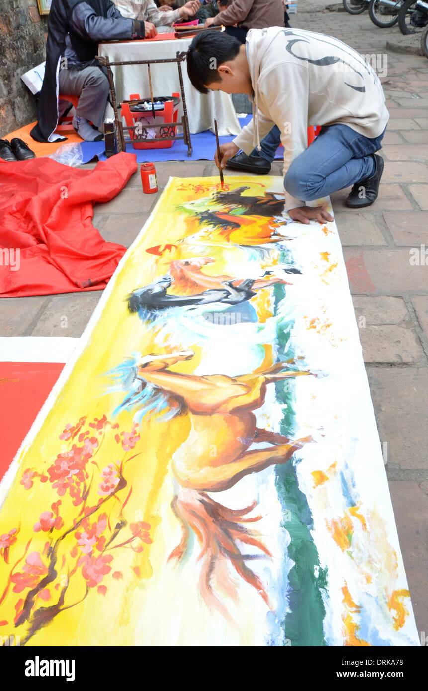 Hanoi, Vietnam. 28th Jan, 2014. A man paints a horse to welcome the ...