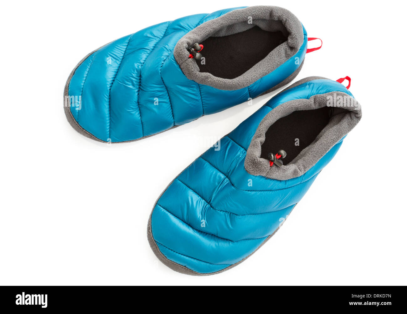 Top down of a pair of cosy warm insulated blue cabin slippers isolated cut out on a white background from above Stock Photo