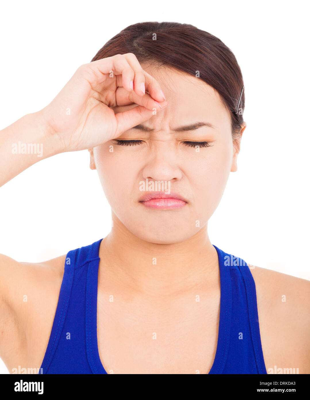 disappointed pretty girl with touching head over white background Stock Photo