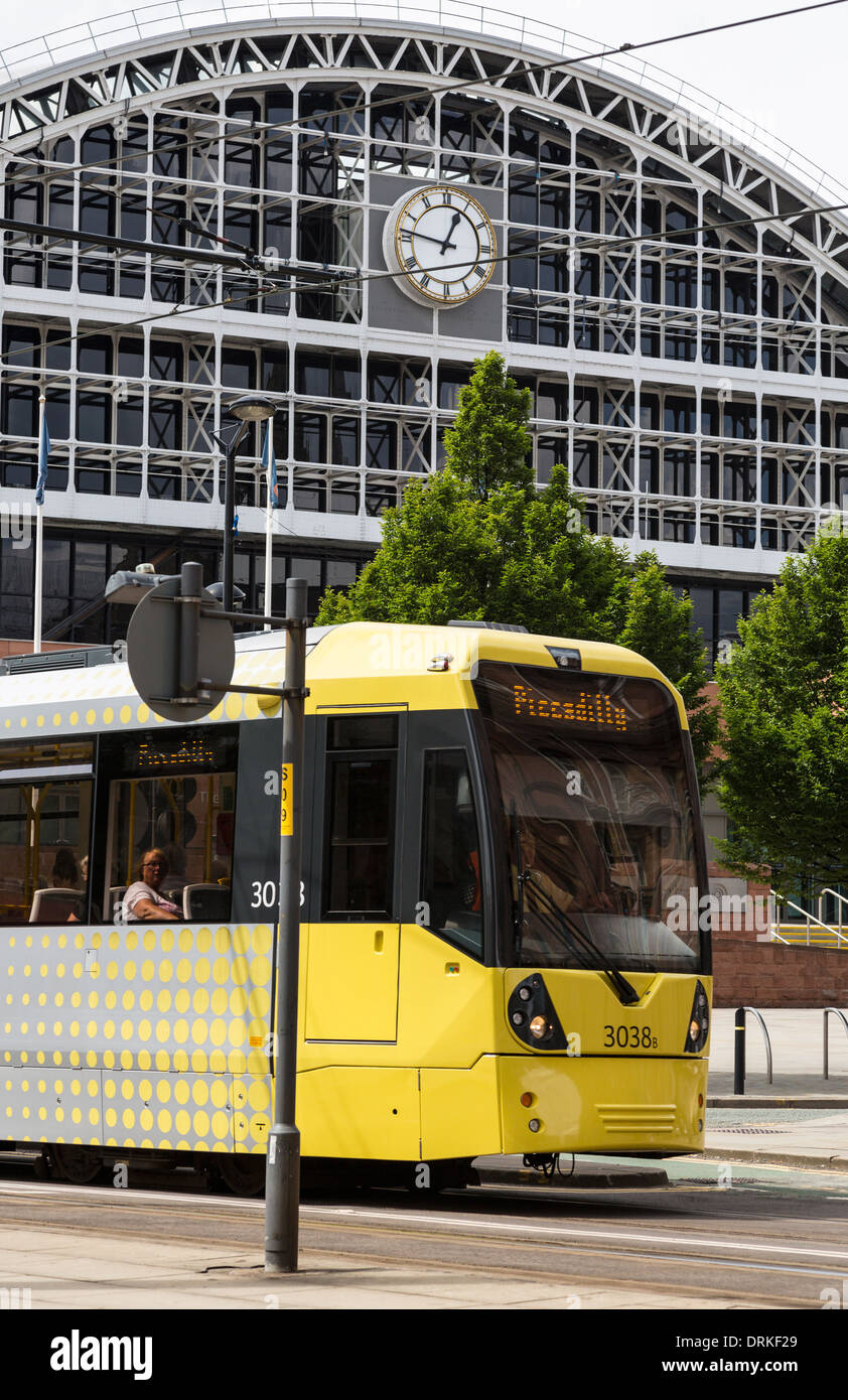 Metrolink tram passes G-MEX centre Manchester city centre, England Stock Photo