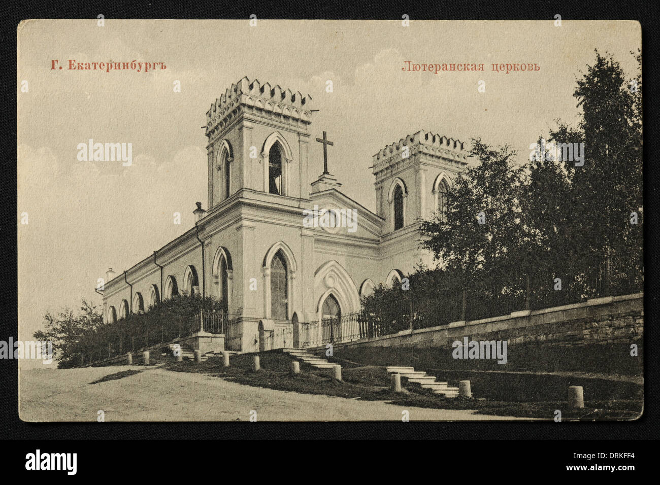 Lutheran Church in Yekaterinburg, Russian Empire. Black and white vintage photograph by Russian photographer Veniamin Metenkov dated from the beginning of the 20th century issued in the Russian vintage postcard published by Veniamin Metenkov himself in Yekaterinburg. Text in Russian: Yekaterinburg. Lutheran Church. The church was demolished by the Bolsheviks in the 1930s. Courtesy of the Azoor Postcard Collection. Stock Photo