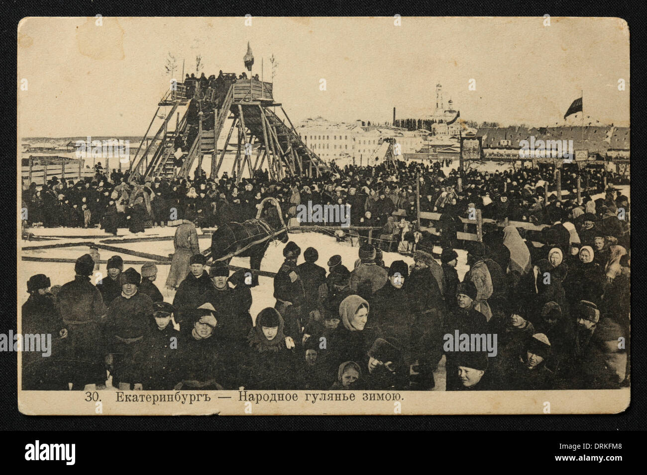 Winter festival in Yekaterinburg, Russian Empire. Black and white vintage photograph by Russian photographer Veniamin Metenkov dated from the beginning of the 20th century issued in the Russian vintage postcard published by Veniamin Metenkov himself in Yekaterinburg. Text in Russian: Yekaterinburg. Winter festival. Courtesy of the Azoor Postcard Collection. Stock Photo