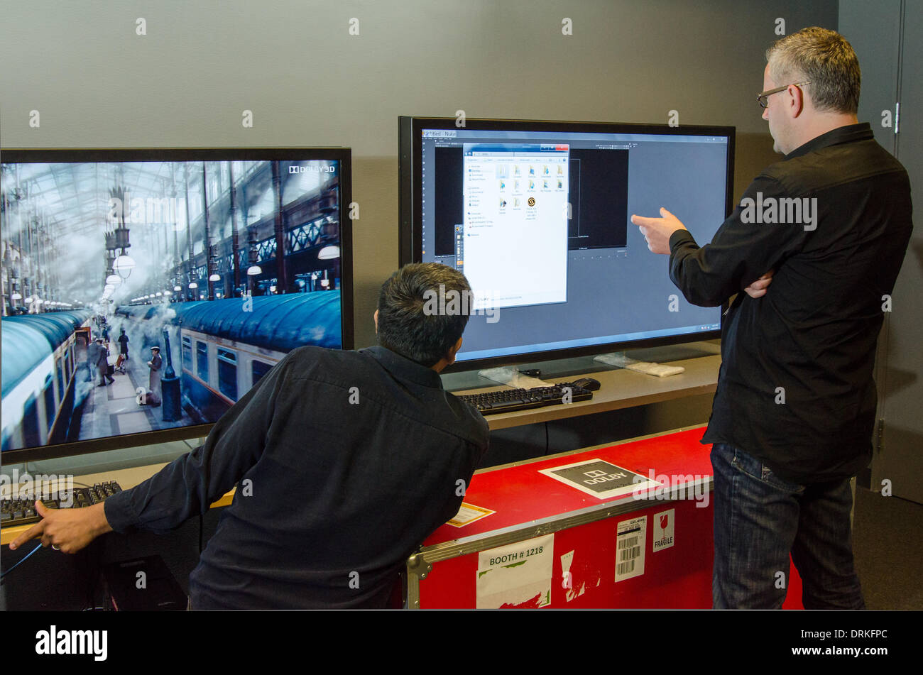 In the company's lab in Sunnyvale, CA, Dolby manager Roland Vlaicu (right) and engineer Prasad Balasubramanian take a close look at the software settings for the new Dolby 3D technology, which enables watching television in 3D without glasses. - 2013. Stock Photo