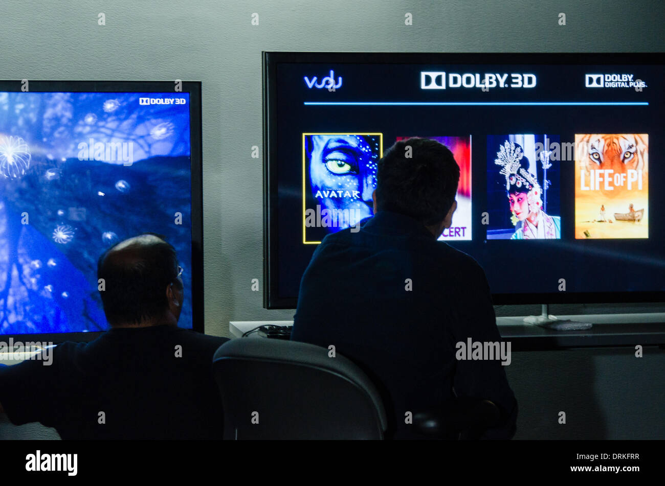 At a Dolby laboratory in Sunnyvale, California, two engineers take a close look at a new Dolby 3D display which enables three-dimensional viewing without glasses. - 2013. Stock Photo