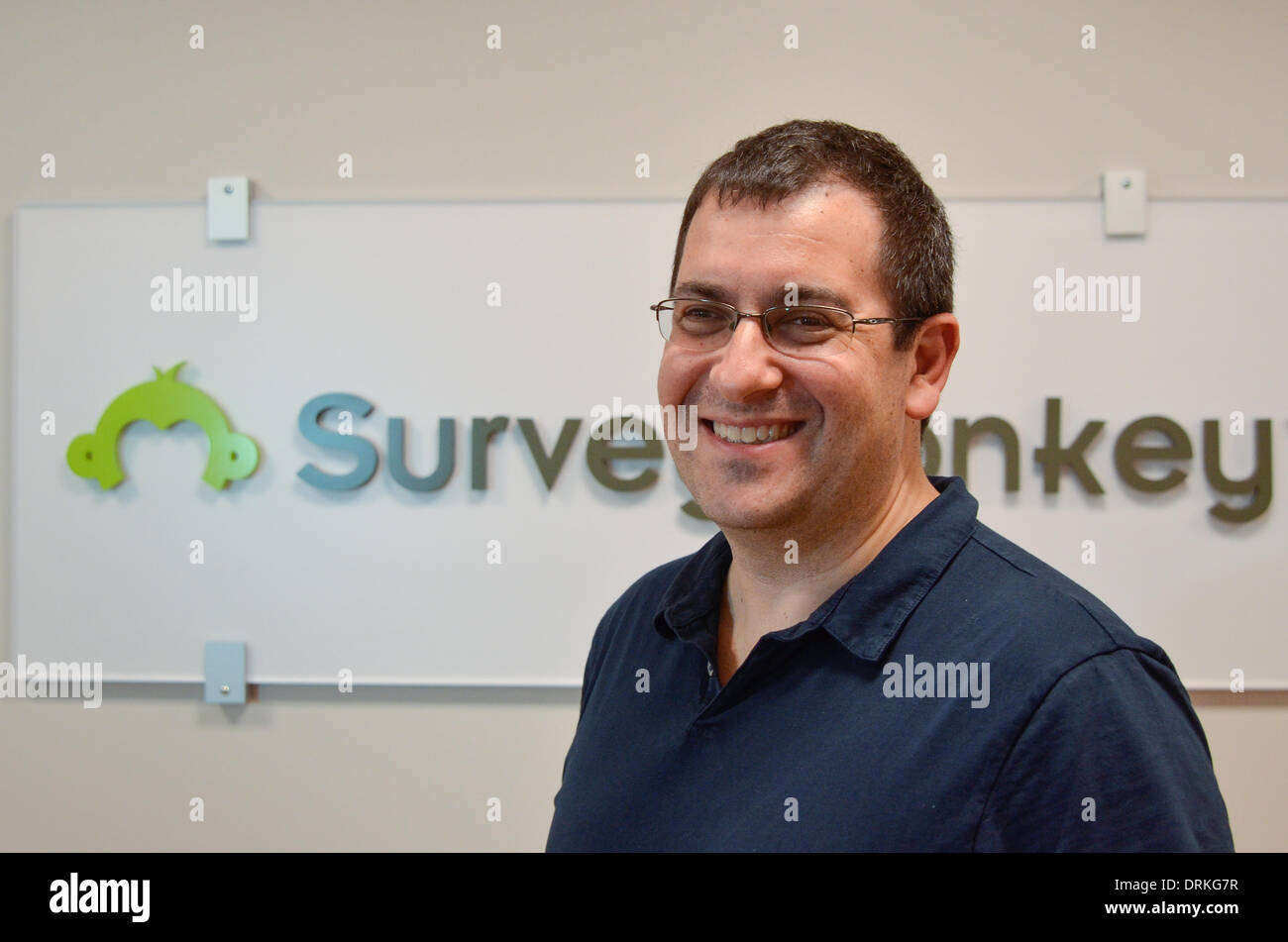 David Goldberg, CEO of online market researcher SurveyMonkey, in front of the company logo at headquarters in Palo Alto, California. Goldberg, a former Yahoo executive, is the husband of Facebook COO and 'Lean In' author Sheryl Sandberg. - 2013. Stock Photo