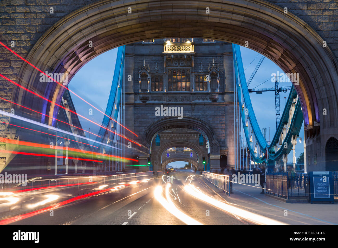 Traffic crosses Tower Bridge at twilight, London, England Stock Photo