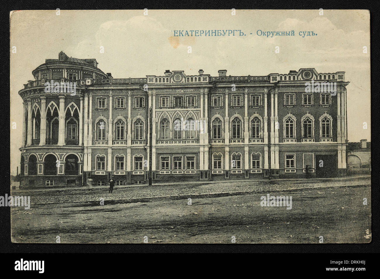 District Court also known as Sevastianov House in Yekaterinburg, Russian Empire. Black and white vintage photograph by Russian photographer Nikolai Vvedensky dated from the beginning of the 20th century issued in the Russian vintage postcard published by M.S. Semkov, Yekaterinburg. Text in Russian: Yekaterinburg. District Court. The District Court also known as Sevastianov House or the Trade Union House is the architectural monument from the 19th century now served as one of the official residences of Russian president. Courtesy of the Azoor Postcard Collection. Stock Photo