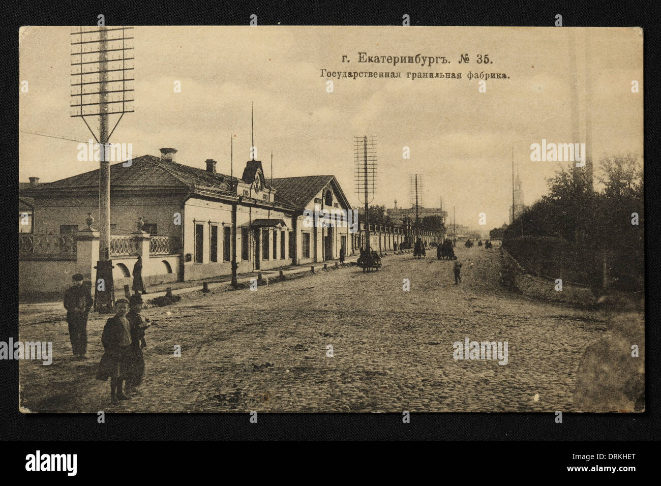 Imperial Lapidary Factory on the factory dam of the City Pond (Gorodskoy Pond) in Yekaterinburg, Russian Empire. Black and white vintage photograph by an unknown photographer dated from the beginning of the 20th century issued in the Russian vintage postcard published by A.S. Suvorin, Yekaterinburg. Text in Russian: Yekaterinburg. State Lapidary Factory. Courtesy of the Azoor Postcard Collection. Stock Photo