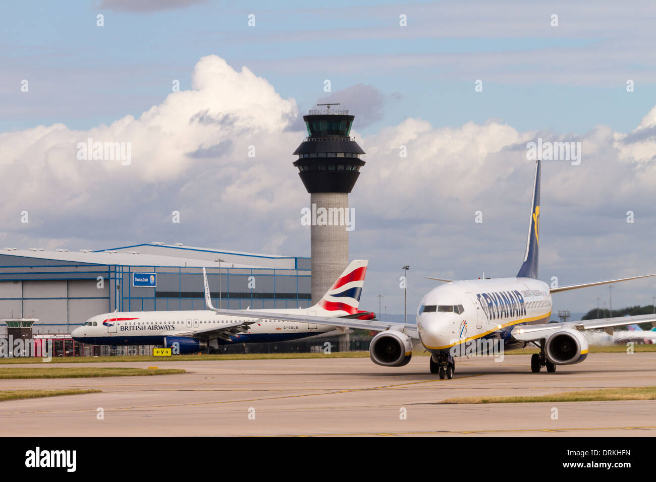 Ryanair Boeing 737 taxis past control tower for take off at Manchester Airport Stock Photo