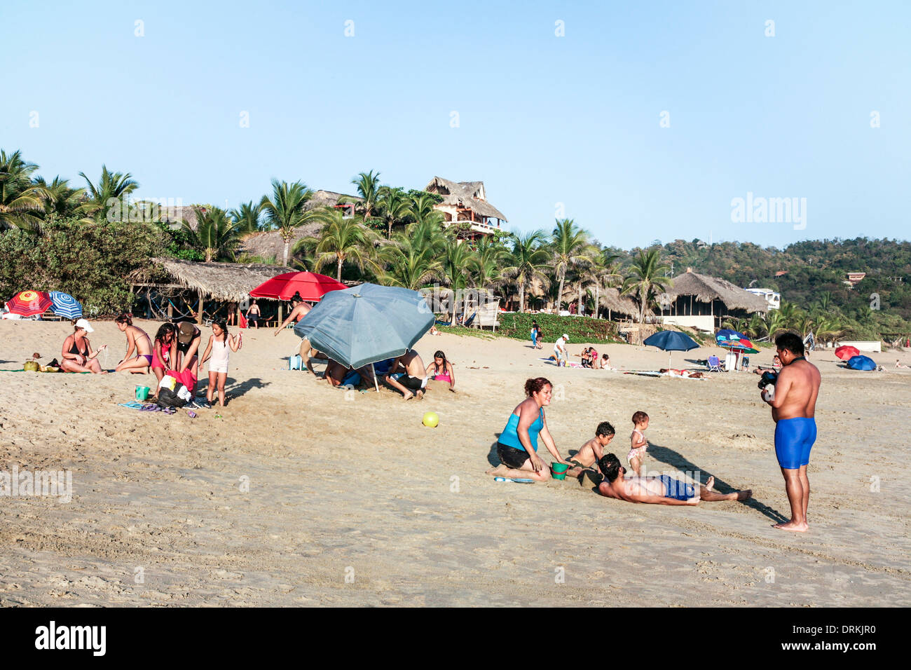 crowded beach on January 31 2013 as people enjoy a relaxing lazy sunny afternoon on the sand before the New Year celebrations Stock Photo