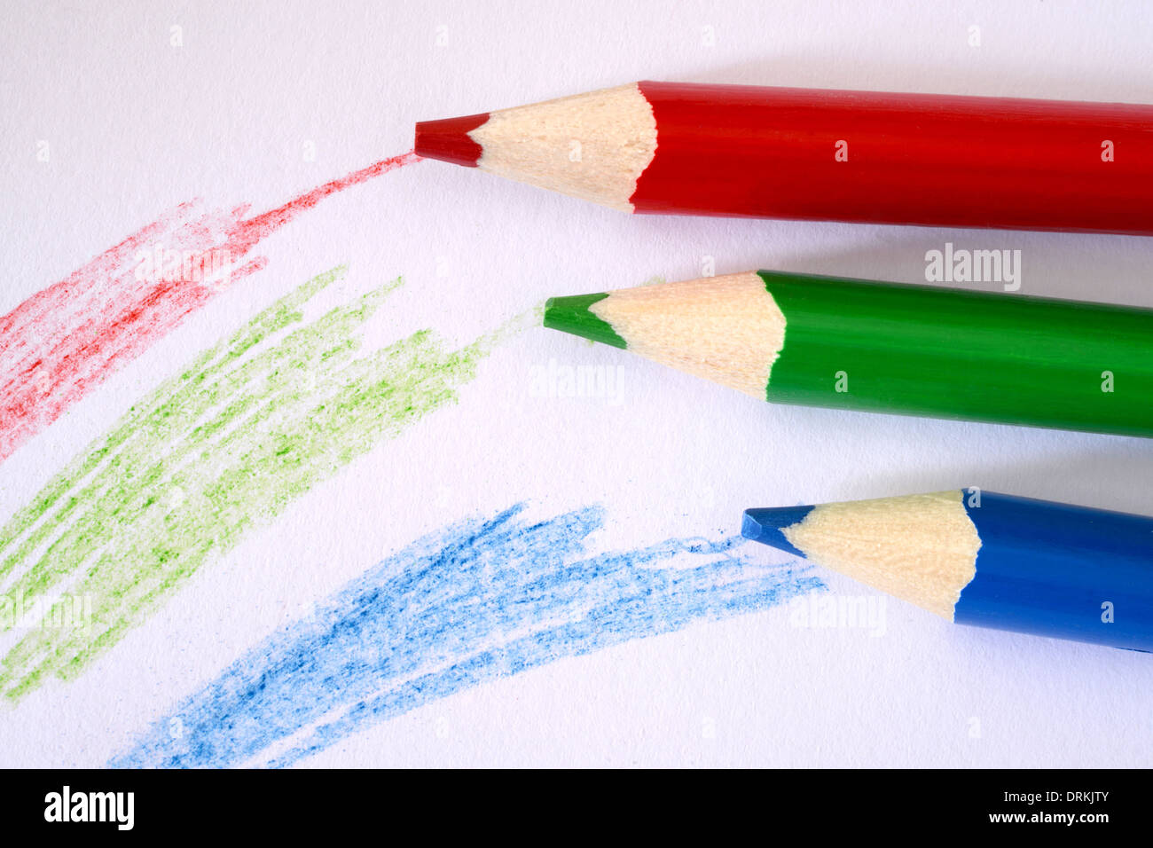 Red blue and green coloured pencils ans scribbles Stock Photo