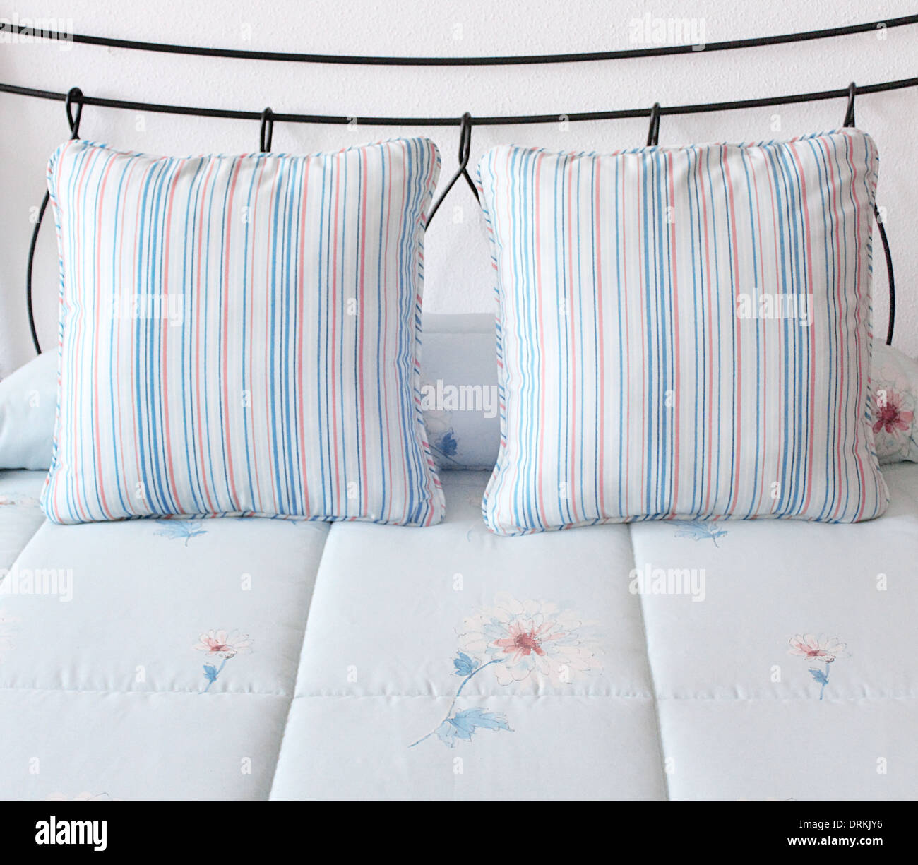 bed with blue cushions Stock Photo Alamy