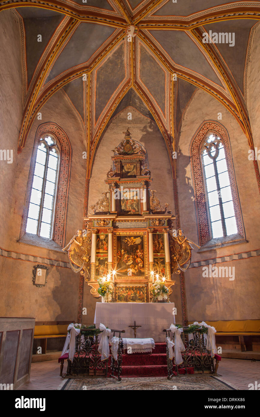 Main altar with the paints by Hans von Achen (1636) and presbytery of gothic evangelical church in Stitnik Stock Photo