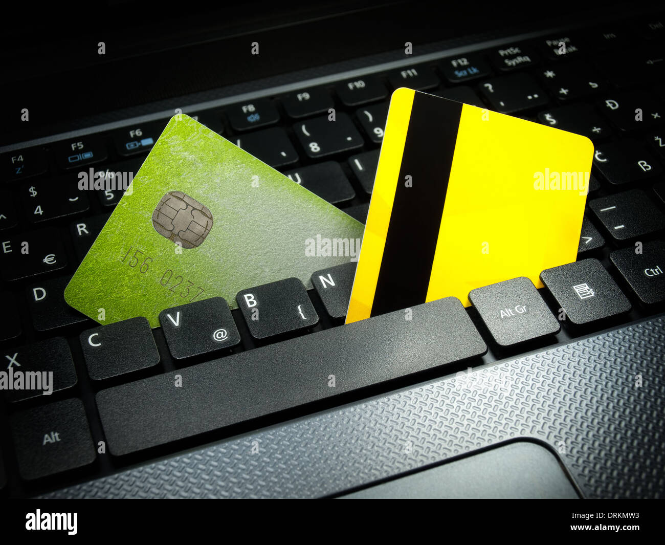 Two credit cards on the computer keyboard symbolizing payments over the internet. Stock Photo
