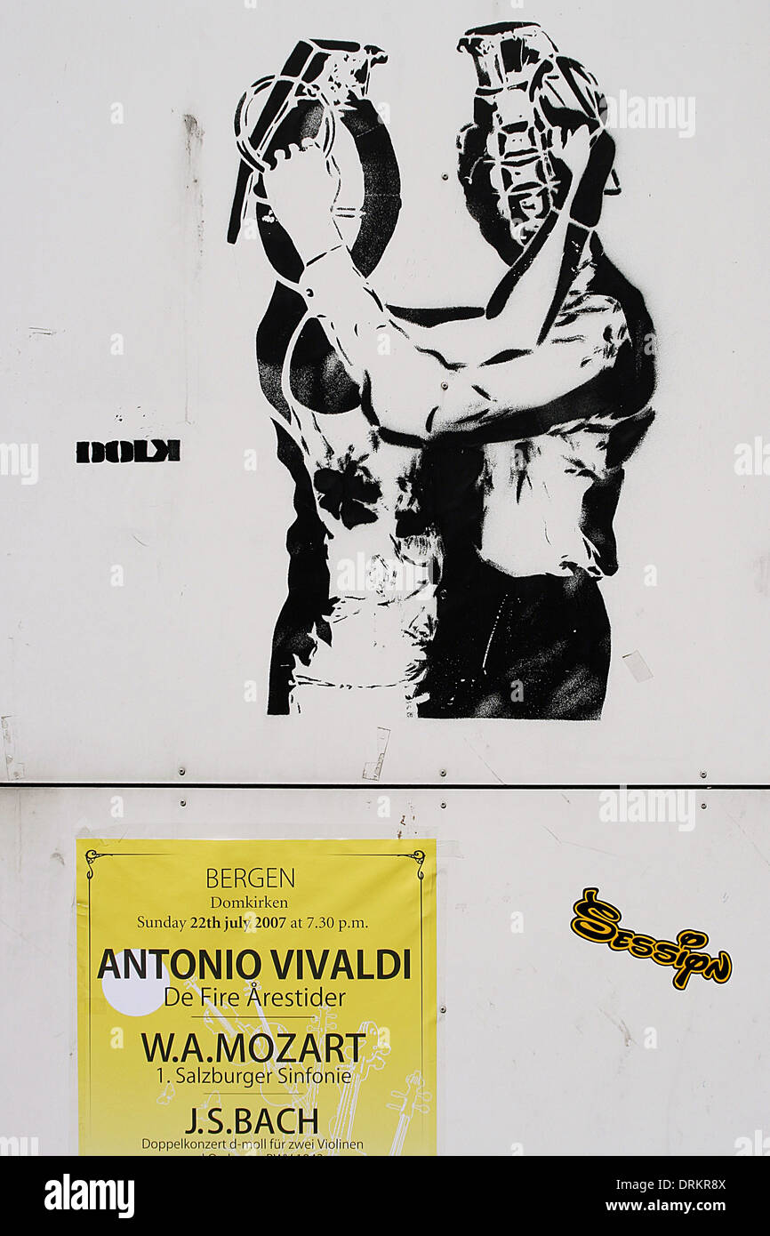 Stencil street art  by Dolk, in Bergen, Norway, depicting two people with hand grenades for heads, embracing. Stock Photo