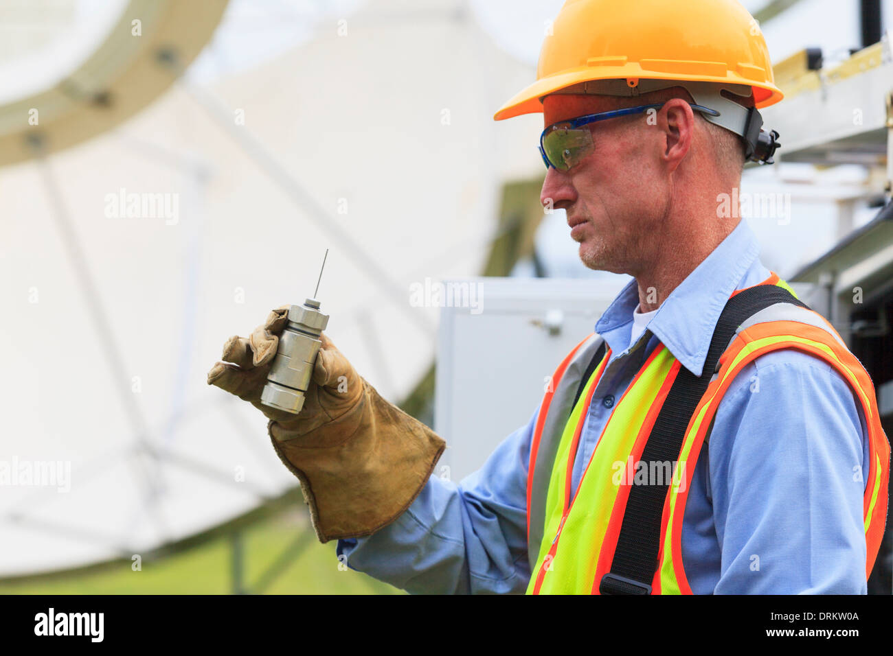 Communications engineer examining LNA pickup for satellite antenna