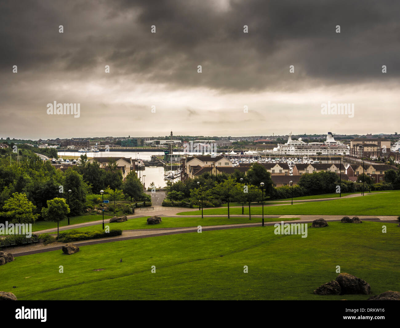 Redburn Dene Park, North Shields with a cruise ship docked in the Port of Tyne, in the background. Tyneside. North East. Stock Photo