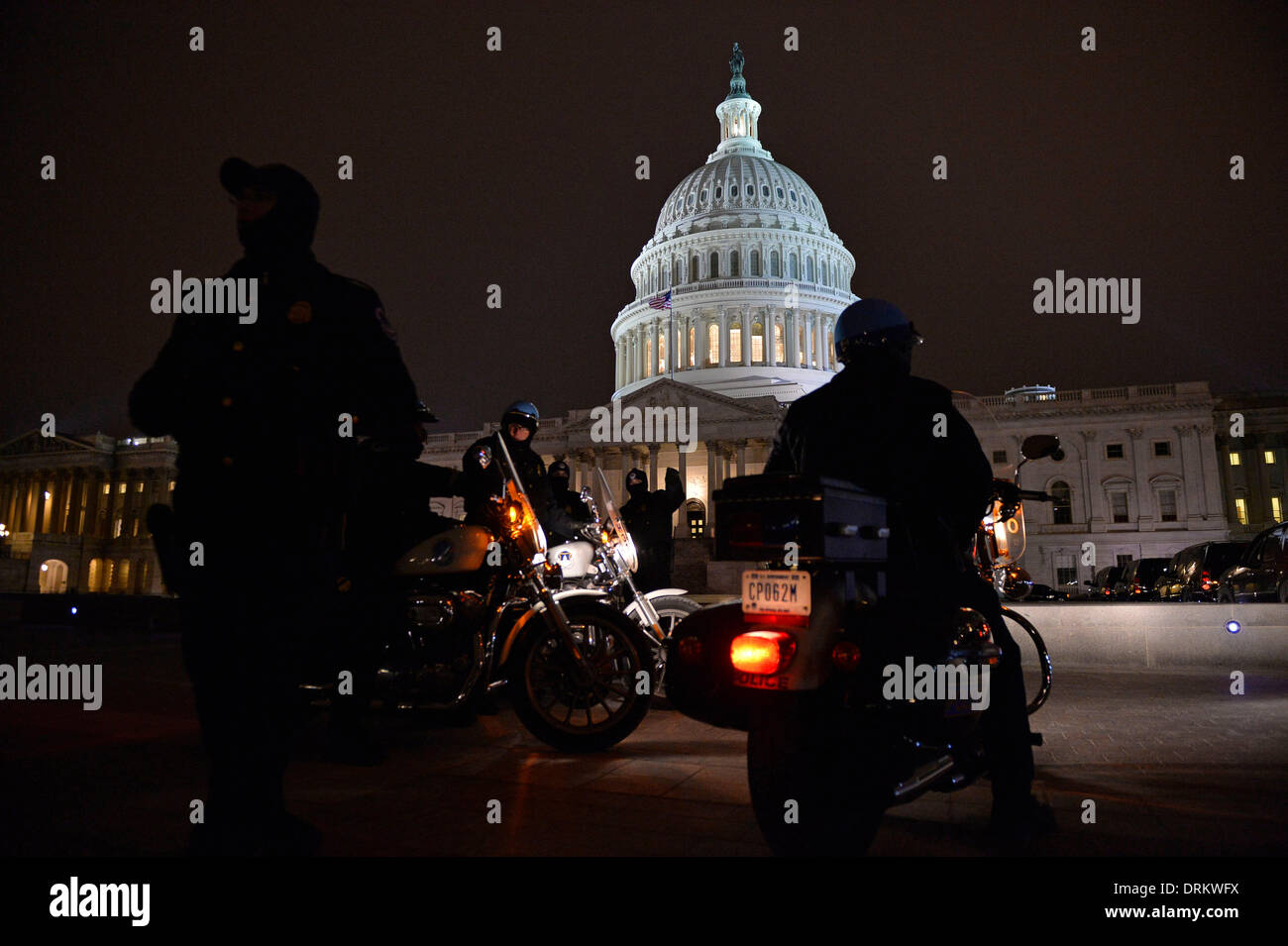 Washington DC, USA. 28th Jan, 2014. Policemen stay alert before U.S. President Barack Obama delivers the State of the Union Address to a joint session of Congress on Capitol Hill in Washington DC, capital of the United States, Jan. 28, 2014. Credit:  Zhang Jun/Xinhua/Alamy Live News Stock Photo