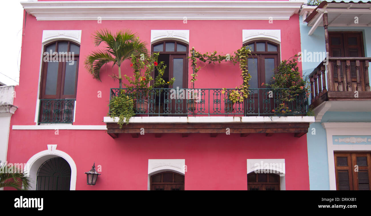 Balcony and plantings on a rosecolored house in Old San Juan, Puerto