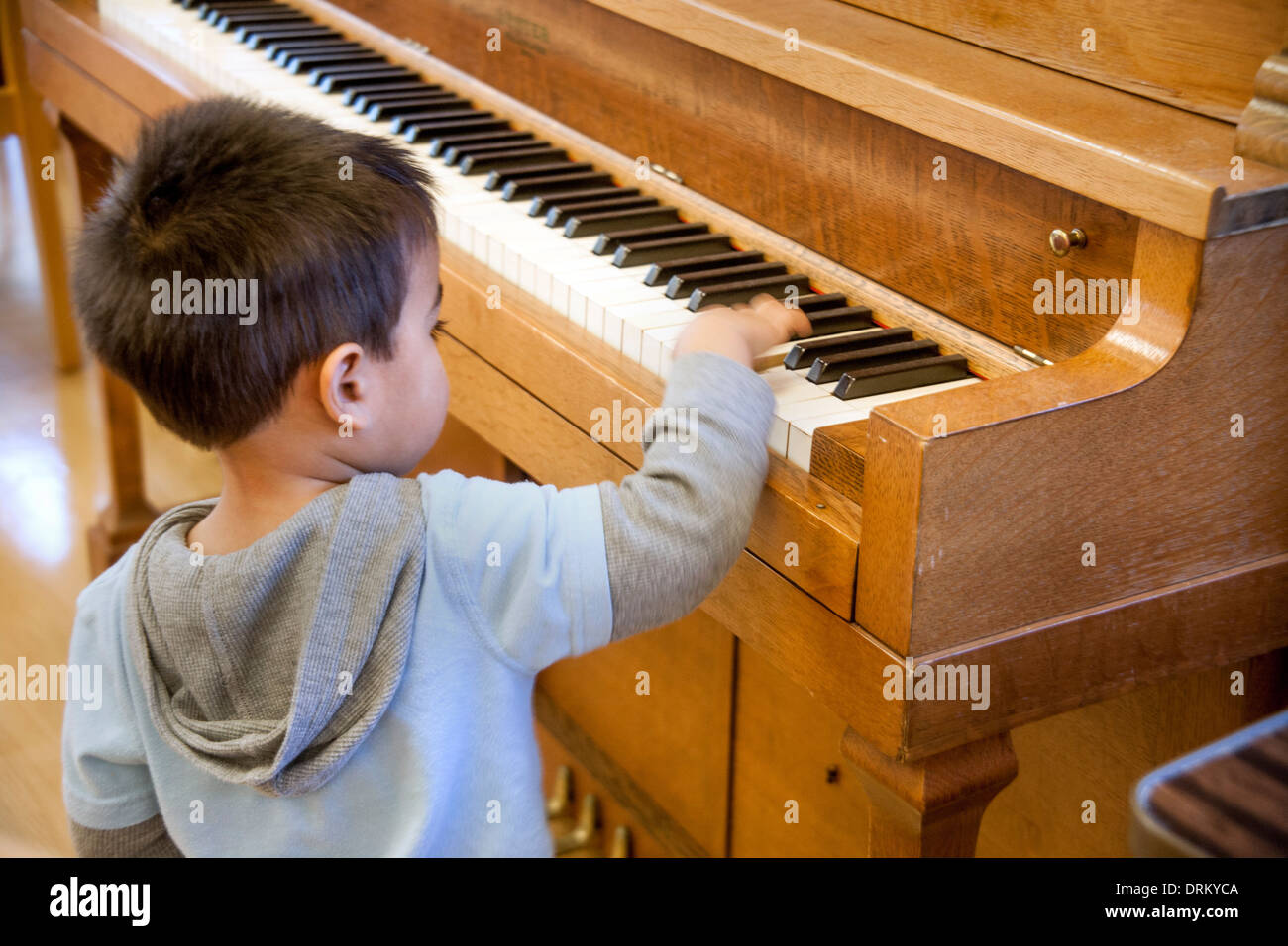 Individual upright pianos exploring explore waist up back turned hires