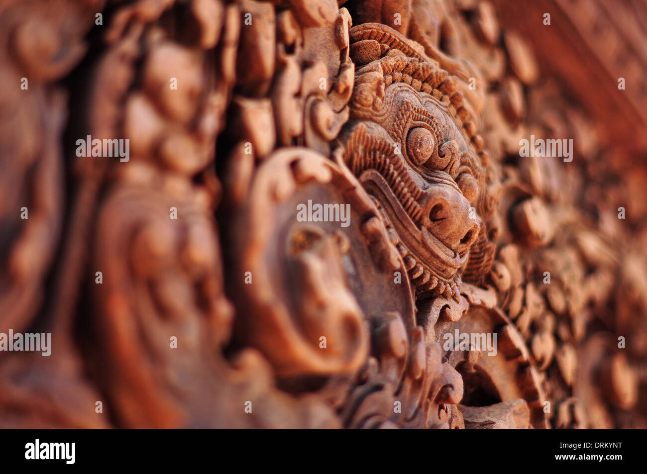Sandstone lintel carving of a kala at the Hindu temple Banteay Srei (or Srey) in the Angkor temple complex in Cambodia Stock Photo