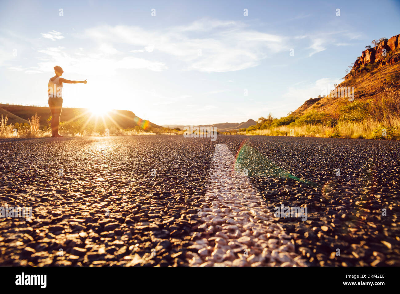 Australia, Young woman hitchhiking Stock Photo Alamy