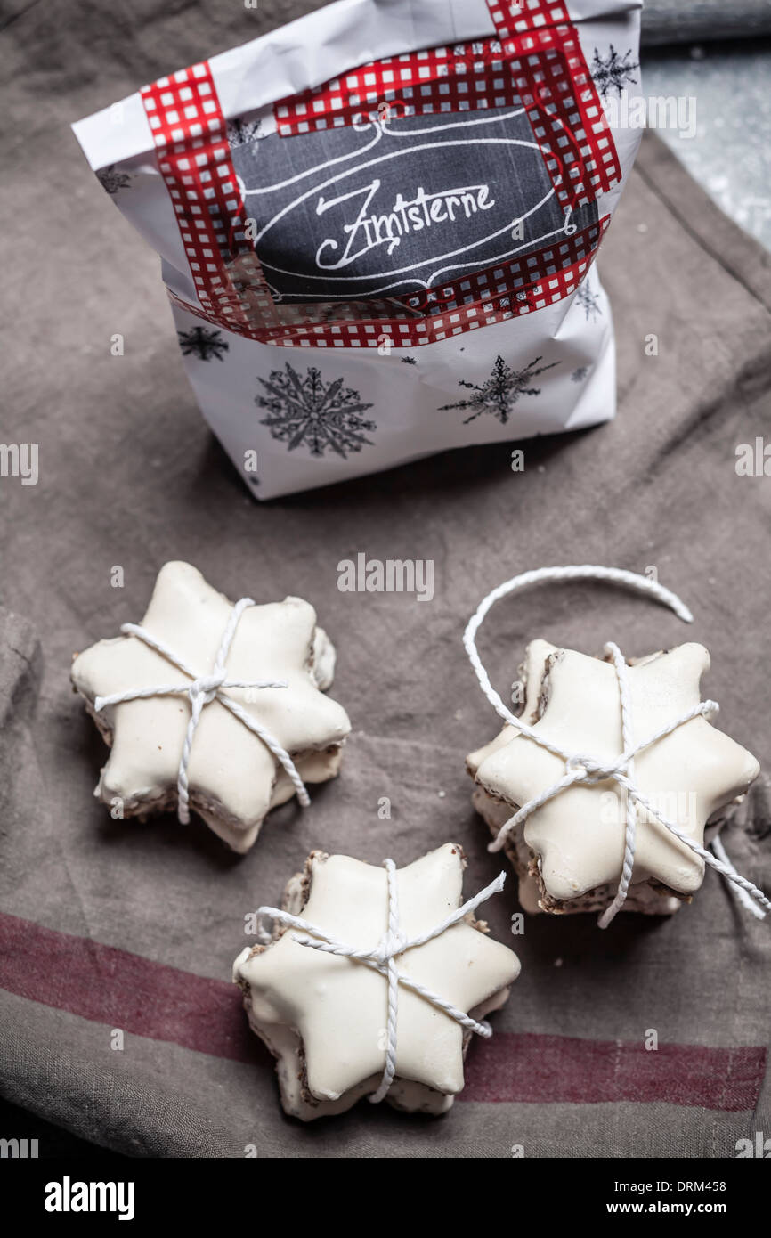 Star-shaped cinnamon cookies and paperbag on linen napkin Stock Photo