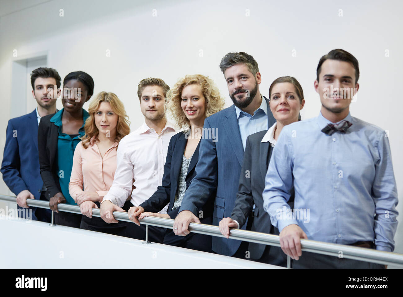 People Standing Behind Railing Germany, Neuss, Group of business people standing behind railing Stock ...