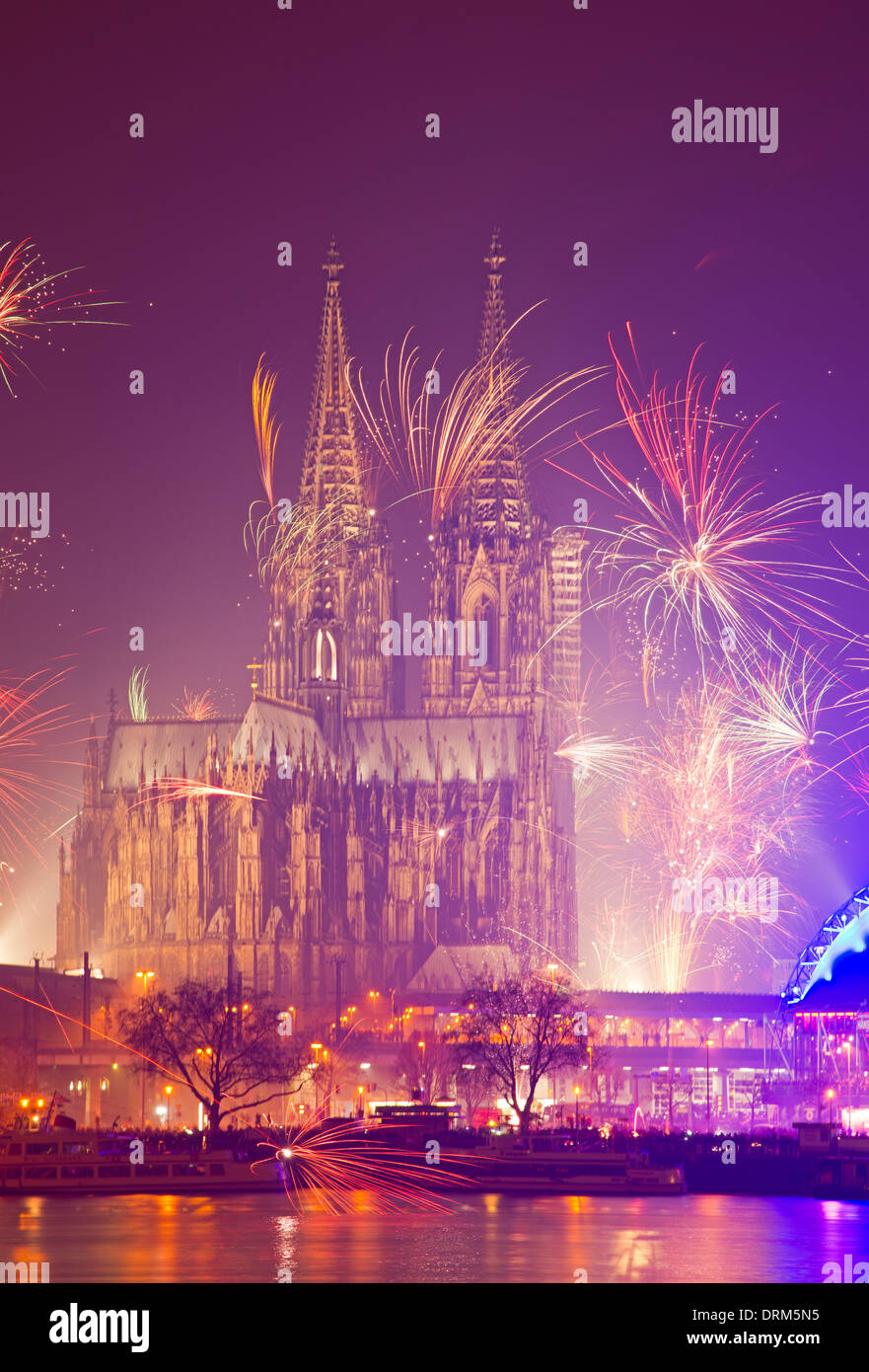 Germany, North Rhine-Westphalia, Cologne, Cologne cathedrale at New Year's Eve with fireworks Stock Photo
