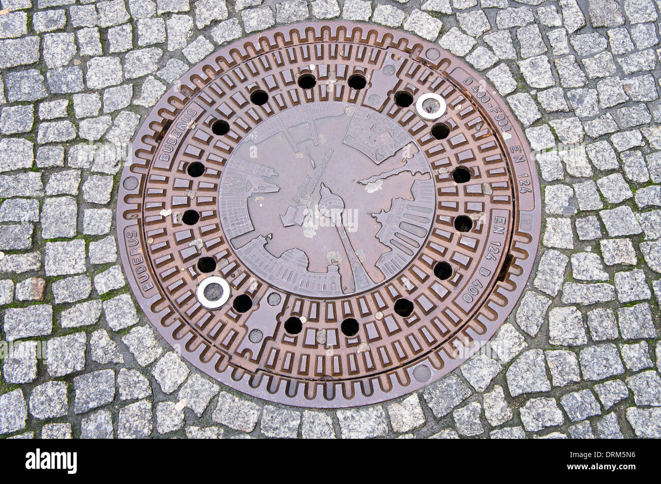 street, sewer lid on a street, Berliner Wasserbetriebe Stock Photo