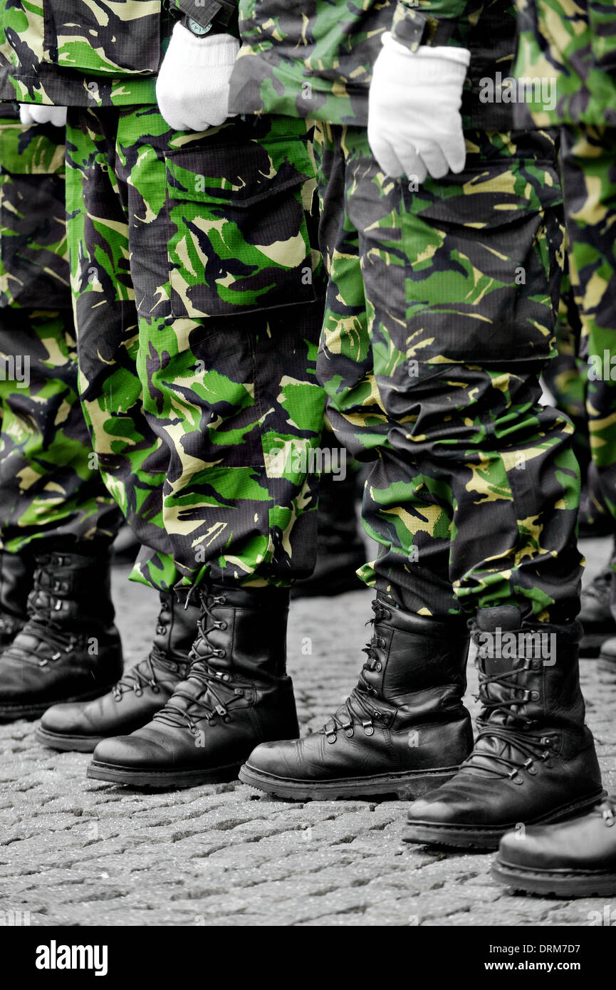 Soldiers in camouflage military uniform in rest position Stock Photo