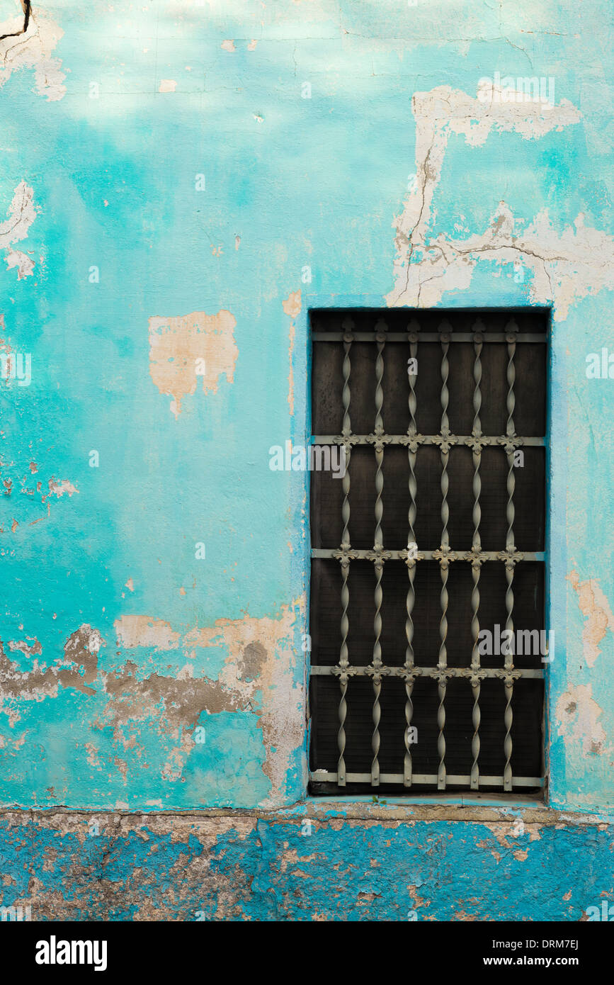 Old window on a weathered blue Mediterranean facade Stock Photo - Alamy